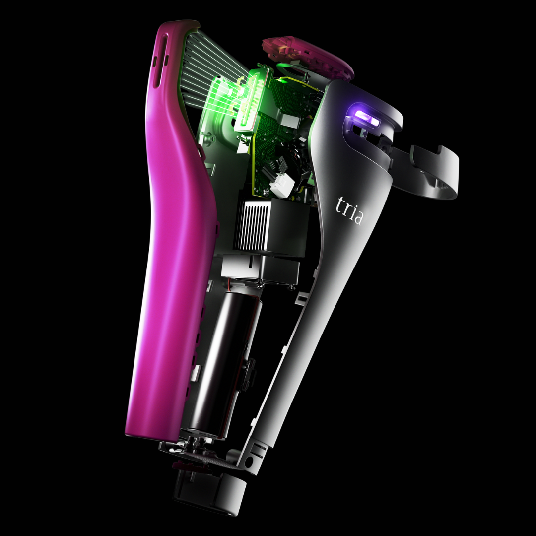 Close-up of a Tria device with purple and green components on a black background